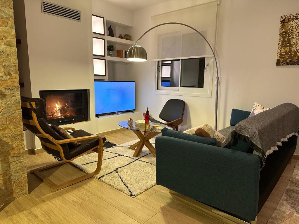 Una televisión o centro de entretenimiento en Chic Apartment in Nature