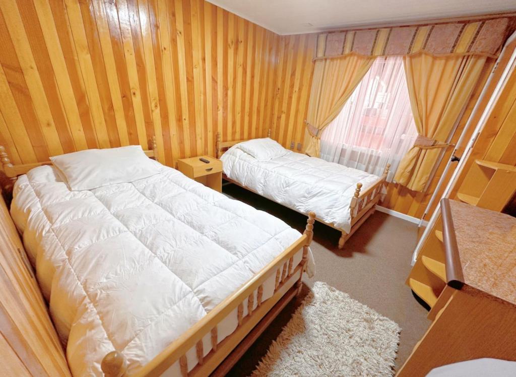 Postel nebo postele na pokoji v ubytování Hospedaje Maria