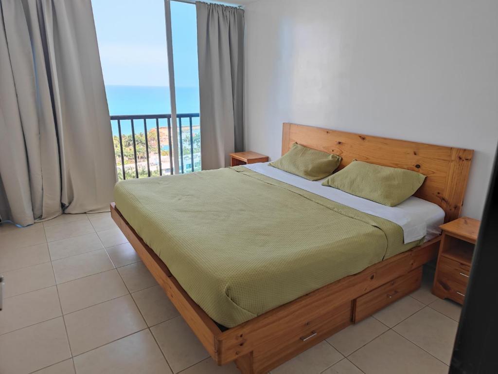 Un pat sau paturi într-o cameră la Relax Punta Centinela