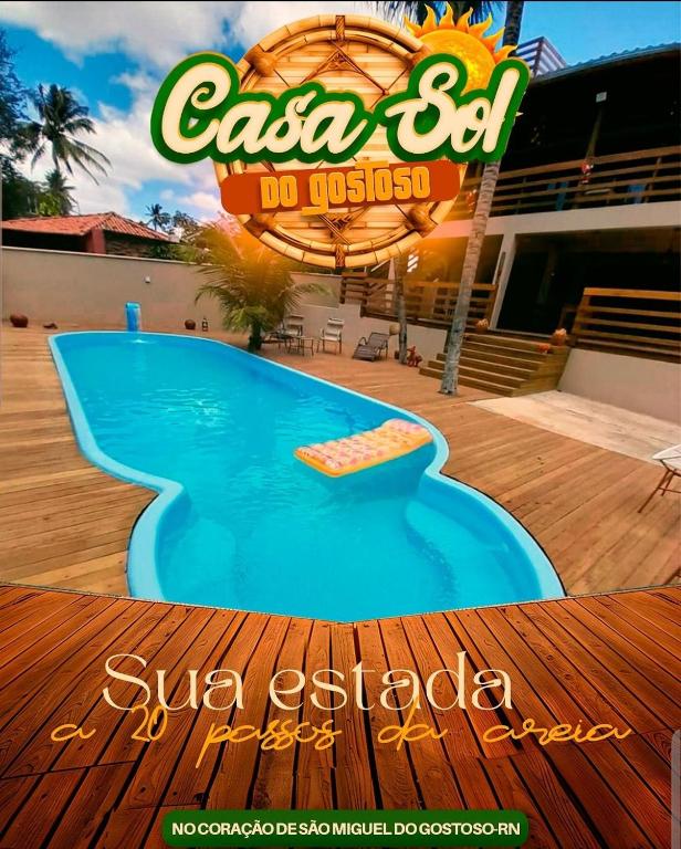 a sign for a swimming pool at a resort at Apto Gostoso andar Cantina in São Miguel do Gostoso