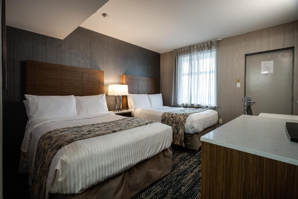 Postel nebo postele na pokoji v ubytování Monte Carlo Inn Toronto West Suites