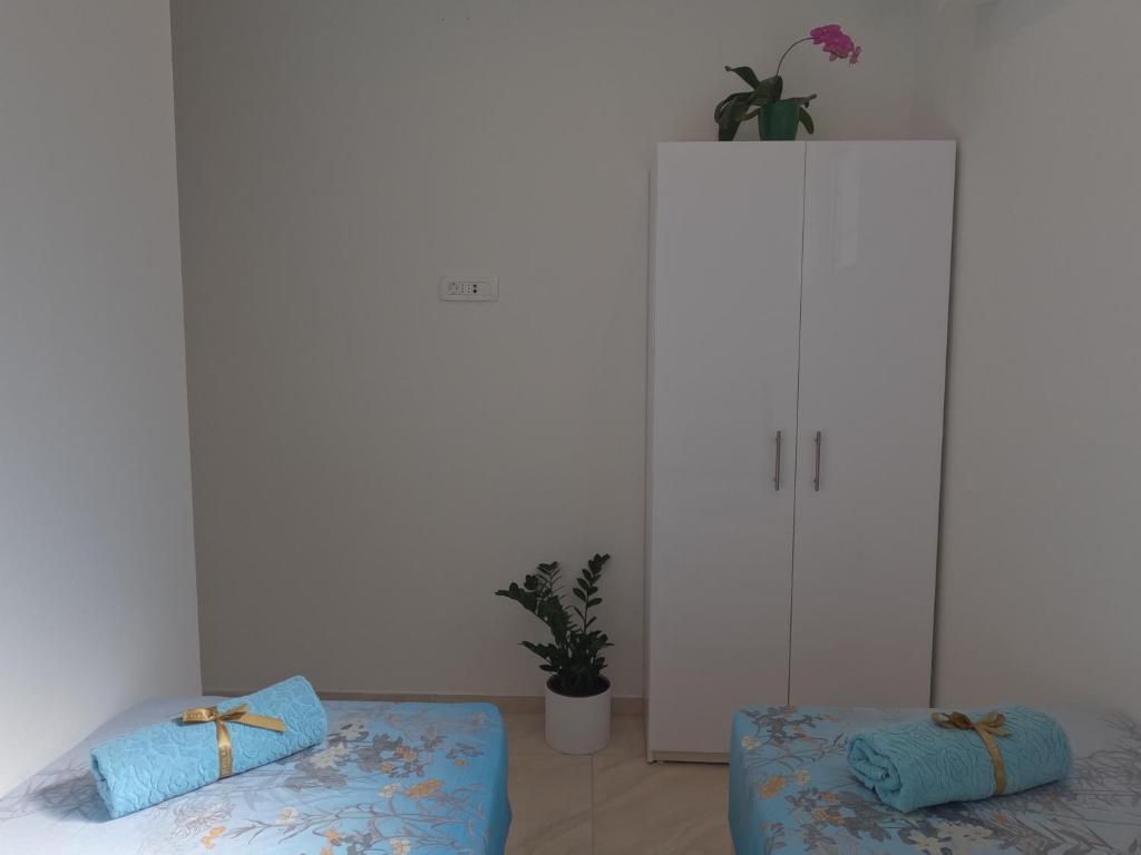 Postel nebo postele na pokoji v ubytování Apartments Branislav 1927