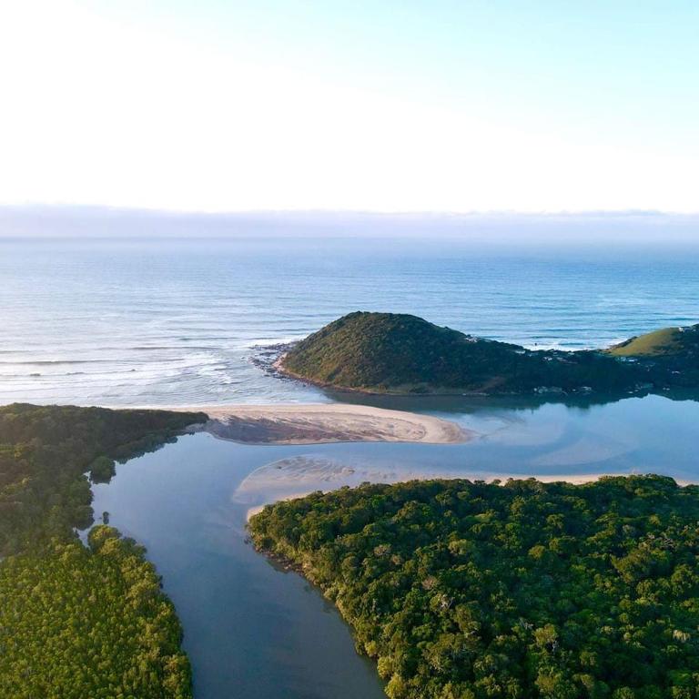 an aerial view of an island in the ocean at UMGAZANA LOOKOUT in Umngazana