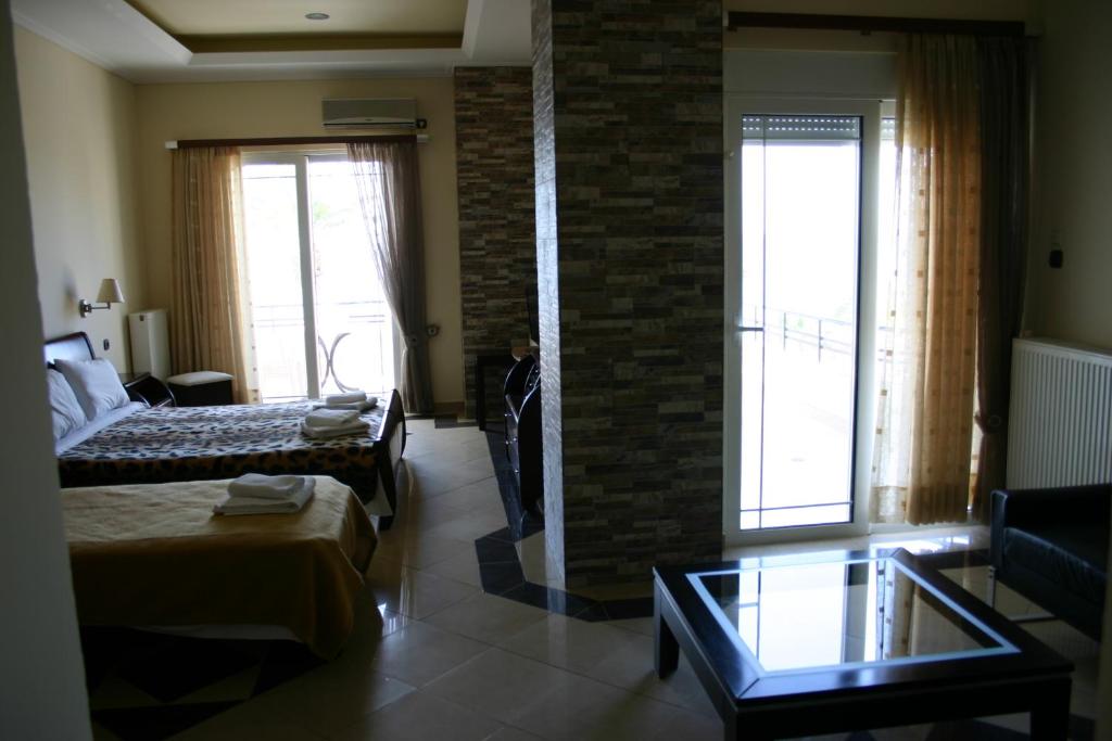 Postel nebo postele na pokoji v ubytování Petit Palais Hotel
