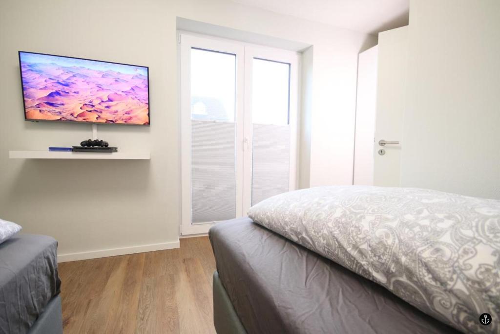 Postel nebo postele na pokoji v ubytování Störtebeker 4