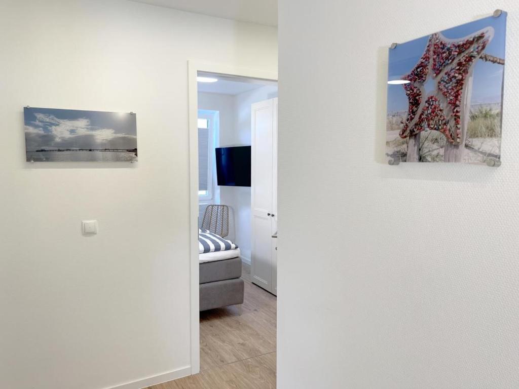 Postel nebo postele na pokoji v ubytování Kellenhusen Tor 8