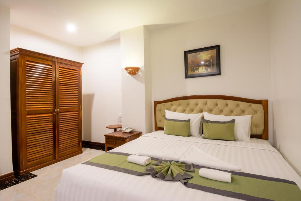 Postel nebo postele na pokoji v ubytování Relax Hotel