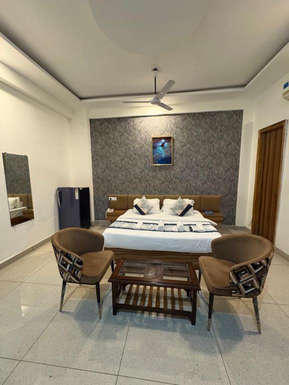 Postel nebo postele na pokoji v ubytování Radiant Blu Hotel