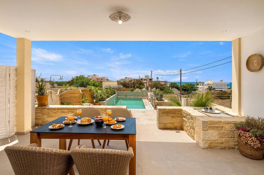 The swimming pool at or close to Ammokrinos Luxury Homes, 150m From Sea