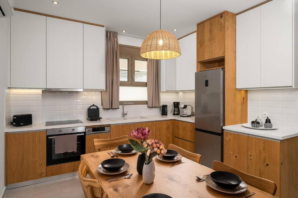 A kitchen or kitchenette at Ammokrinos Luxury Homes, 150m From Sea