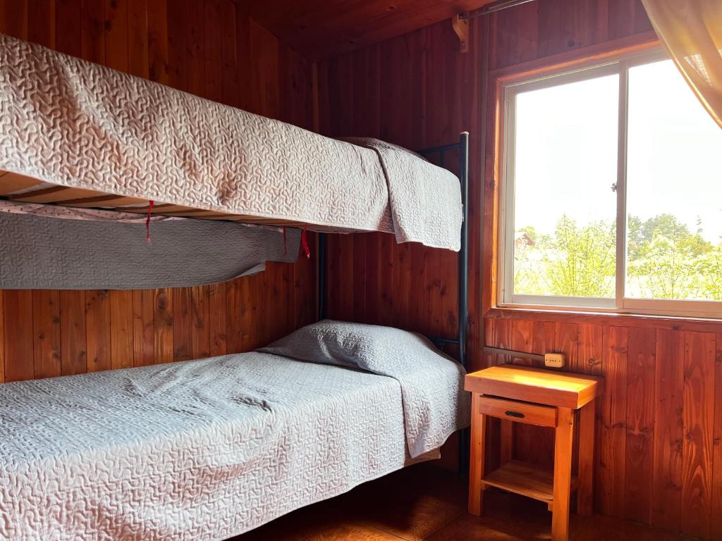 Ένα ή περισσότερα κρεβάτια σε δωμάτιο στο Cabaña Patricia