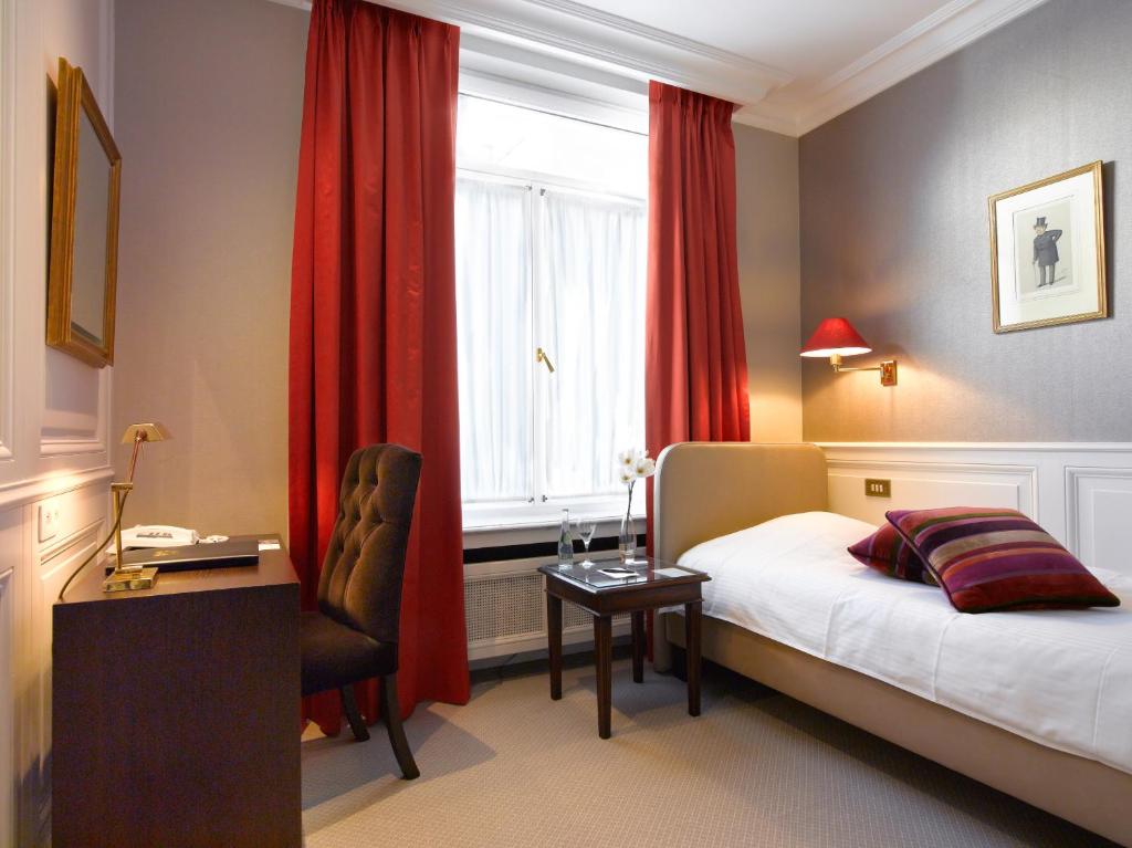 Postel nebo postele na pokoji v ubytování Hotel Damier Kortrijk