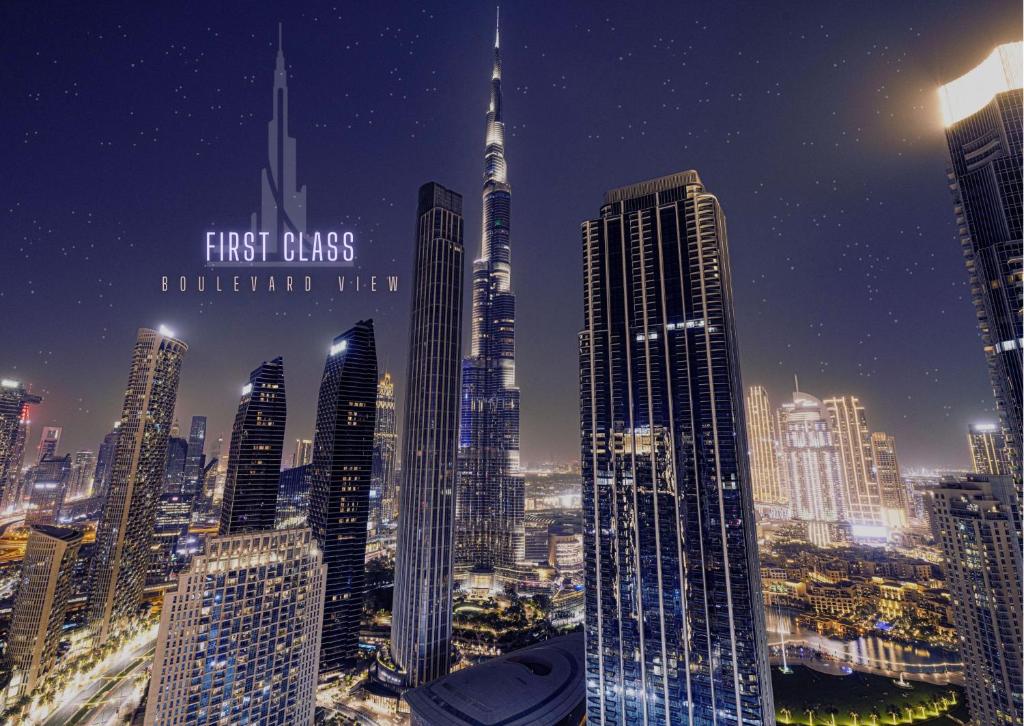 a view of a city skyline at night at Burj Crown - First Class Boulevard View, 9 min Walk Dubai Mall in Dubai