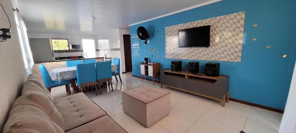 TV a/nebo společenská místnost v ubytování Cantinho do aconchego