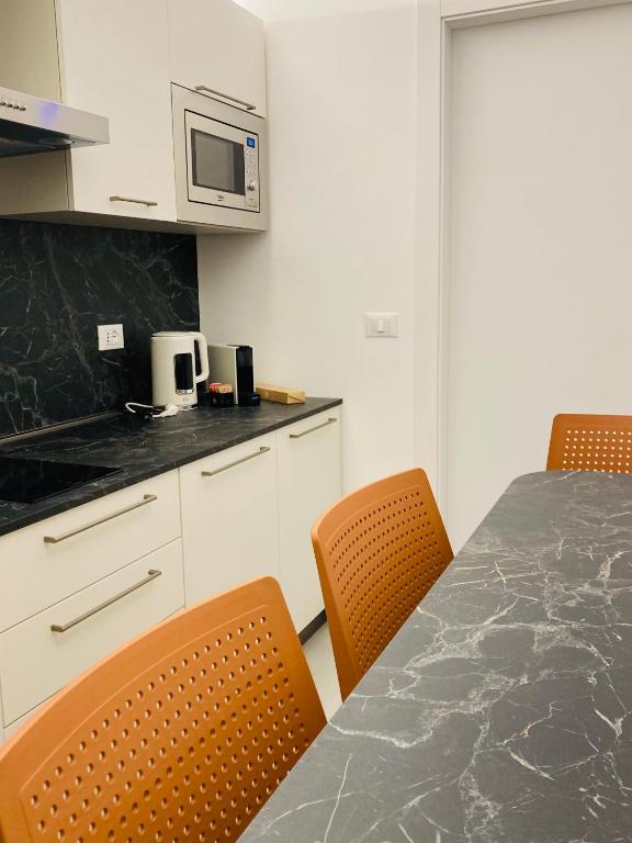 Kuchyň nebo kuchyňský kout v ubytování Frangente Home