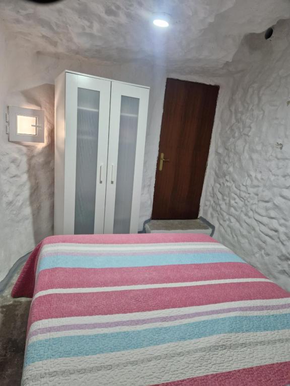 Postel nebo postele na pokoji v ubytování Cueva de David