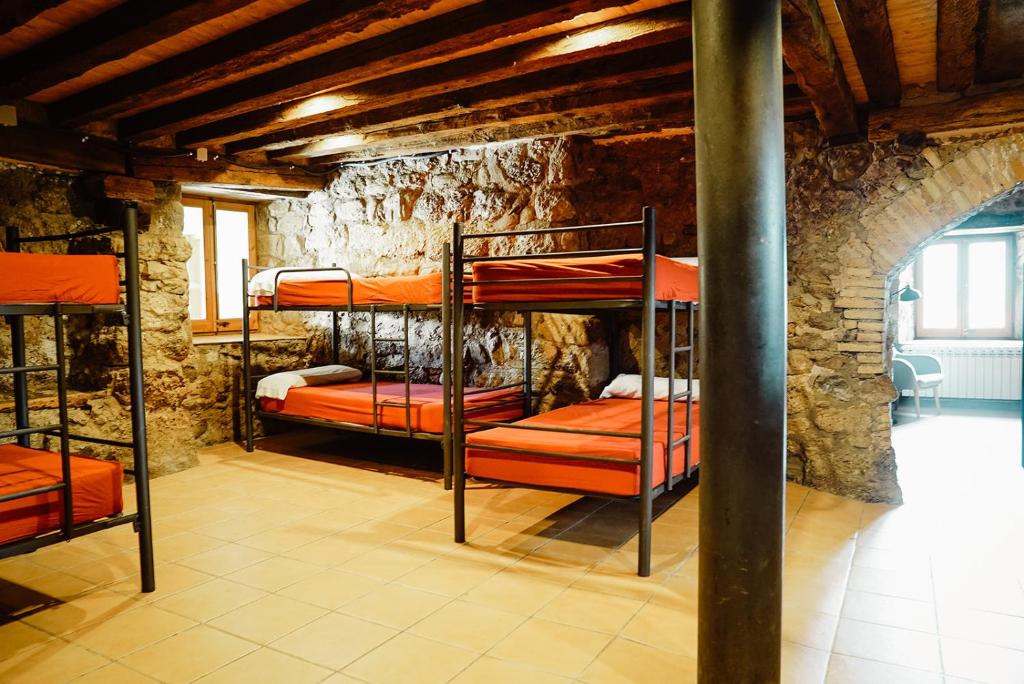 Postel nebo postele na pokoji v ubytování Cases Altes de Posada