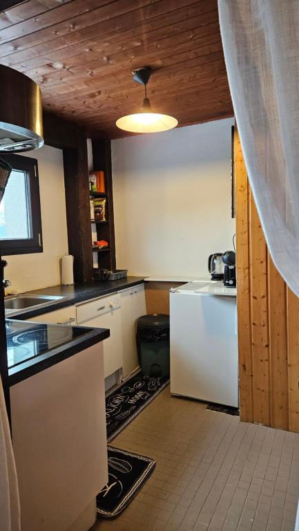 Kuchyň nebo kuchyňský kout v ubytování L'appel Chalet