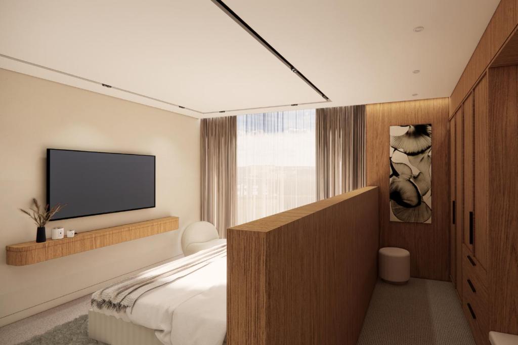 TV a/nebo společenská místnost v ubytování Maxim Hotel - Auckland