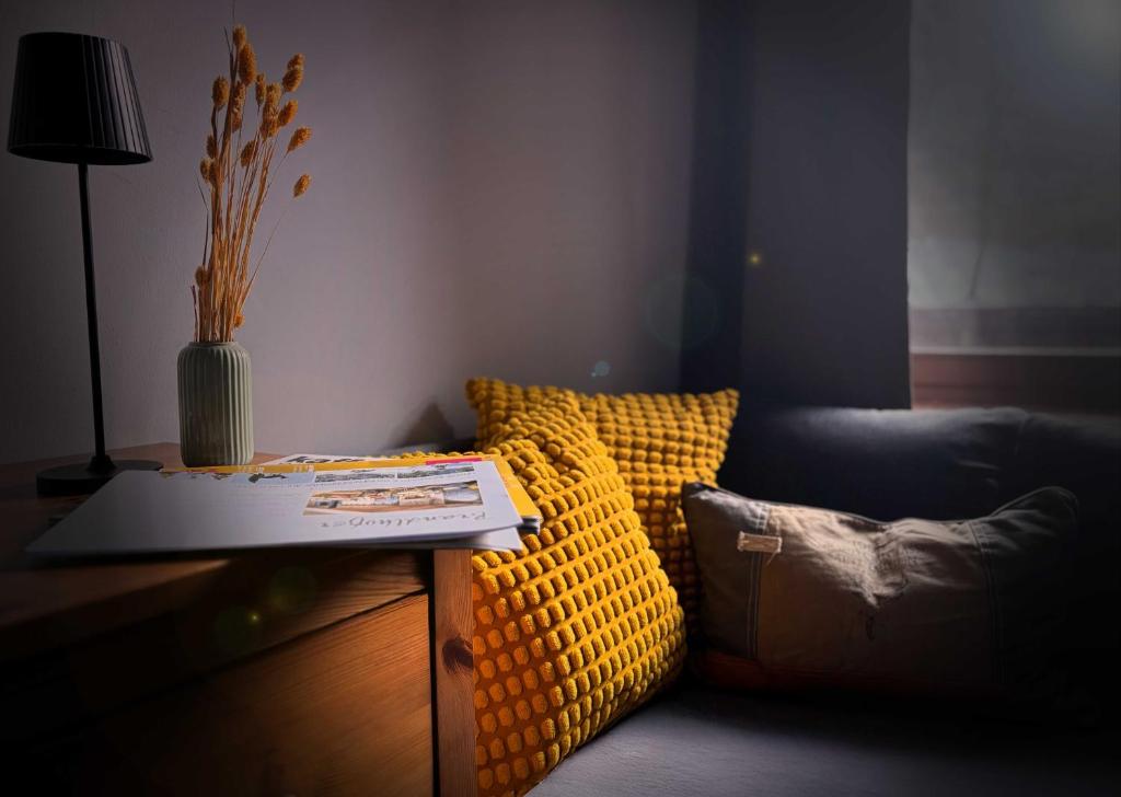 a living room with a couch and a table at Pension Almhof Baumgarten in Bad Reichenhall