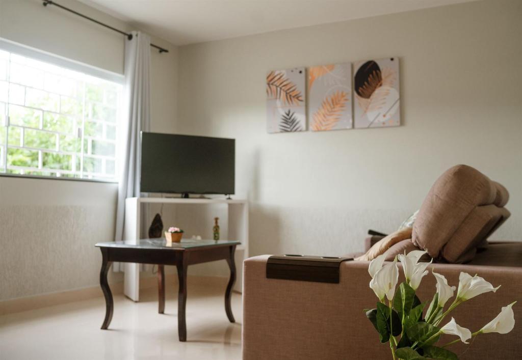 TV a/nebo společenská místnost v ubytování Casa da Tia Jô