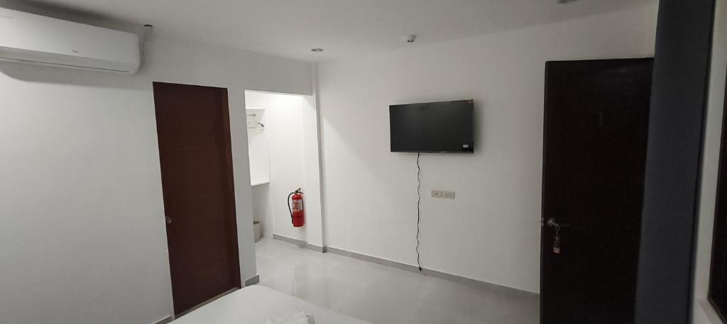 TV a/nebo společenská místnost v ubytování Viva La Rosa Hometel