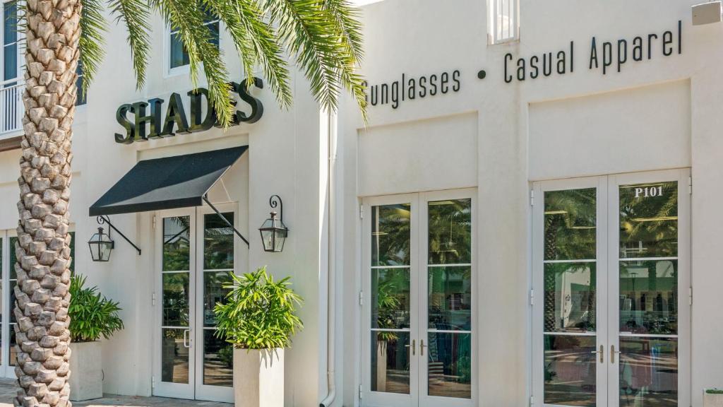 a store with a palm tree in front of it at Lazy Days in Seacrest