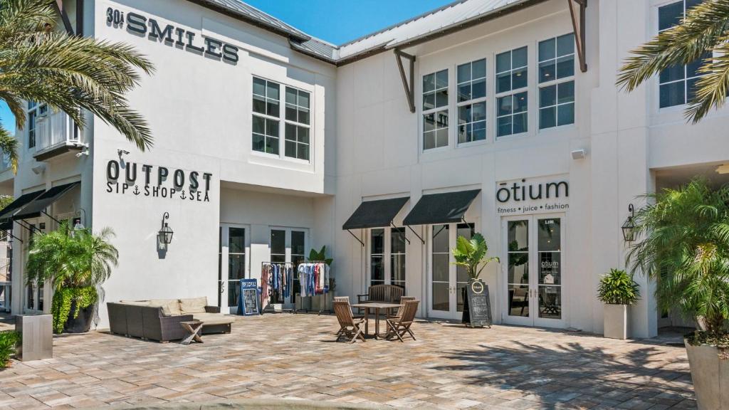 a building with a patio in front of it at Lazy Days in Seacrest