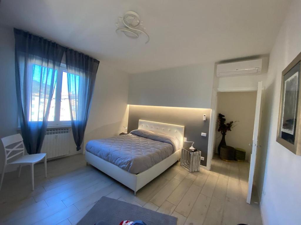 Postel nebo postele na pokoji v ubytování APPARTAMENTO BLU - Relax and Comfort 20 minutes from Florence