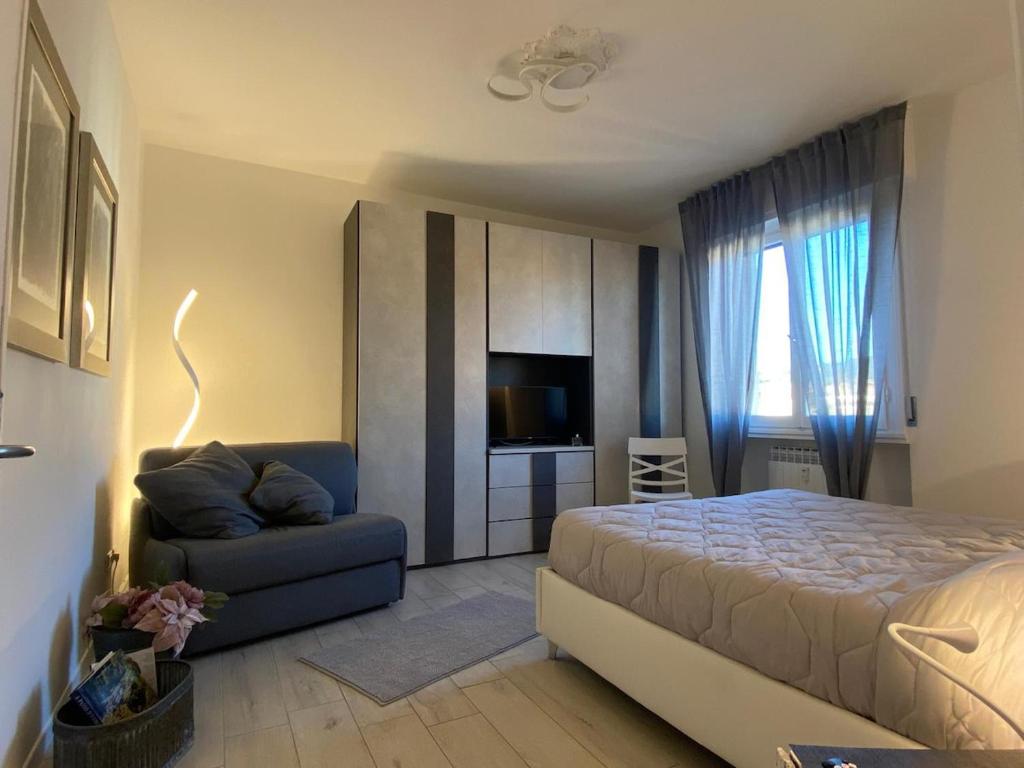 Postel nebo postele na pokoji v ubytování APPARTAMENTO BLU - Relax and Comfort 20 minutes from Florence
