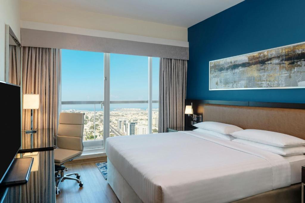 
One Bedroom King Suite with Balcony - Complimentary shuttle service to Dubai Mall and Kite Beach
