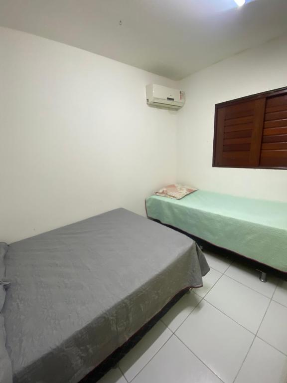 Postel nebo postele na pokoji v ubytování Casa barra nova