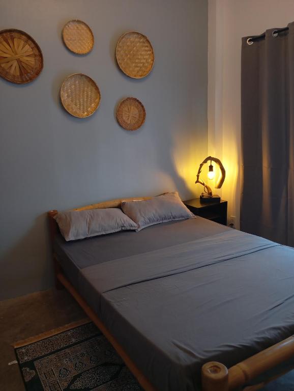 Postel nebo postele na pokoji v ubytování Tsada Balay Homestay
