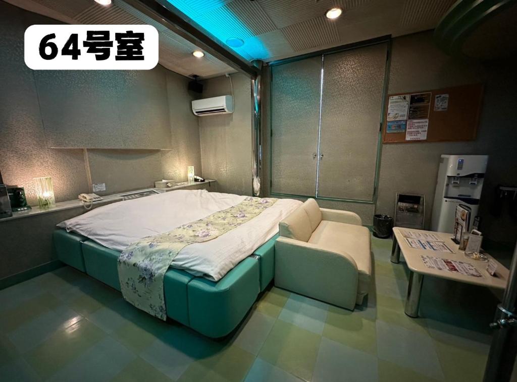 Postel nebo postele na pokoji v ubytování 大人専用ホテルイエスタディ