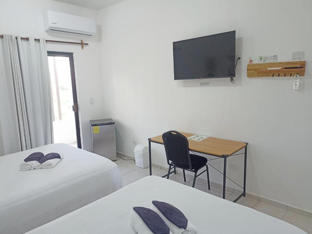 Letto o letti in una camera di Tauch Cancún Centro