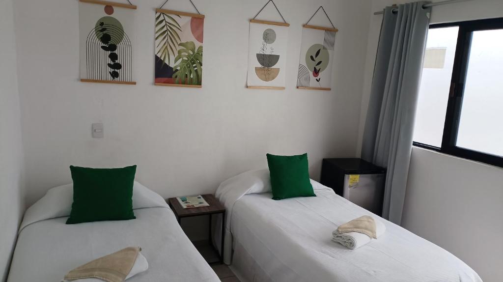Letto o letti in una camera di Tauch Cancún Centro