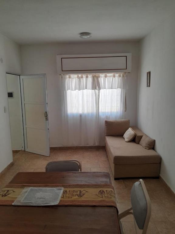 a living room with a couch and a table at Milli in Gualeguaychú