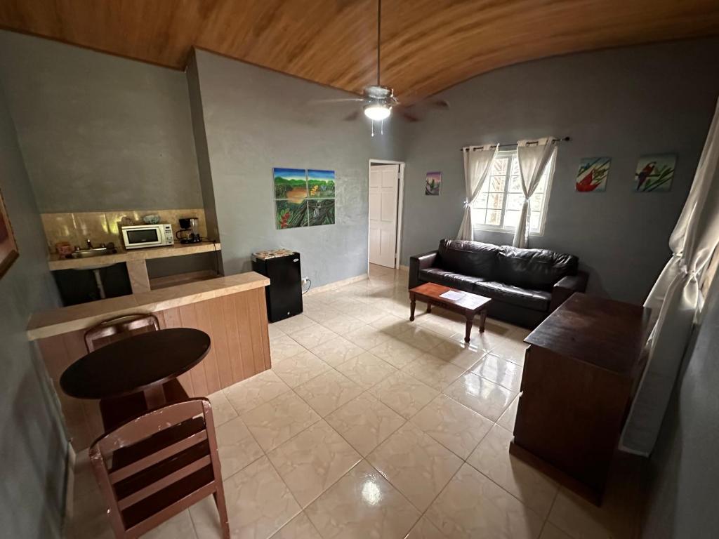 a living room with a couch and a table at Hostal Lopez El Valle Cabañas in El Valle