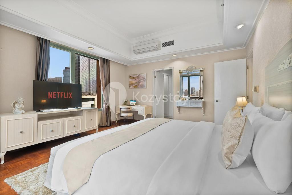 En eller flere senge i et værelse på Brassia by Kozystay - Thamrin