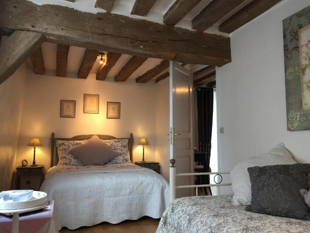 Postel nebo postele na pokoji v ubytování B&B les Agapanthes