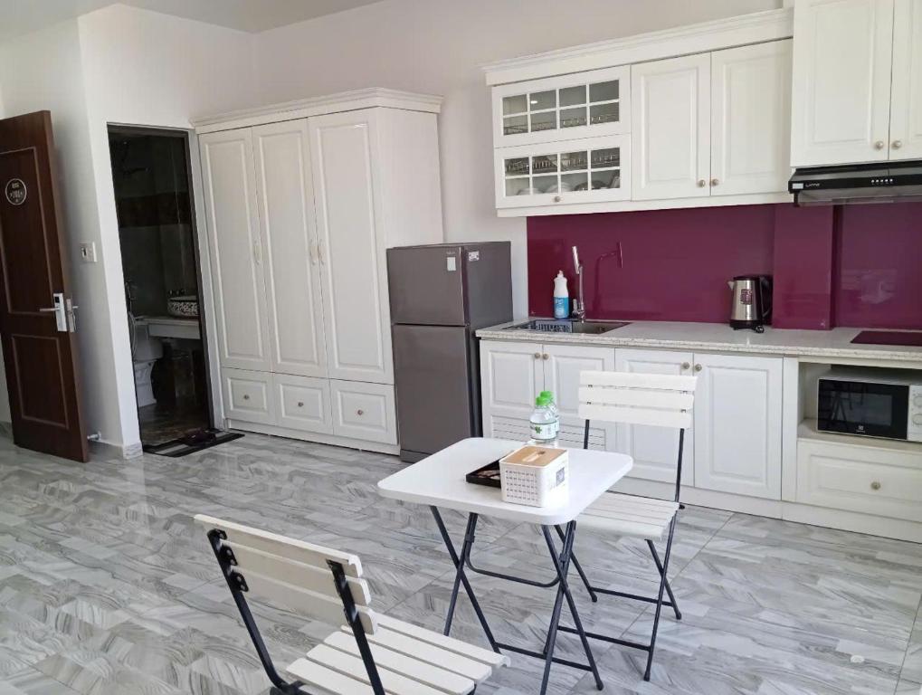 Kuchyň nebo kuchyňský kout v ubytování TQ 3 Hotel & Apartment
