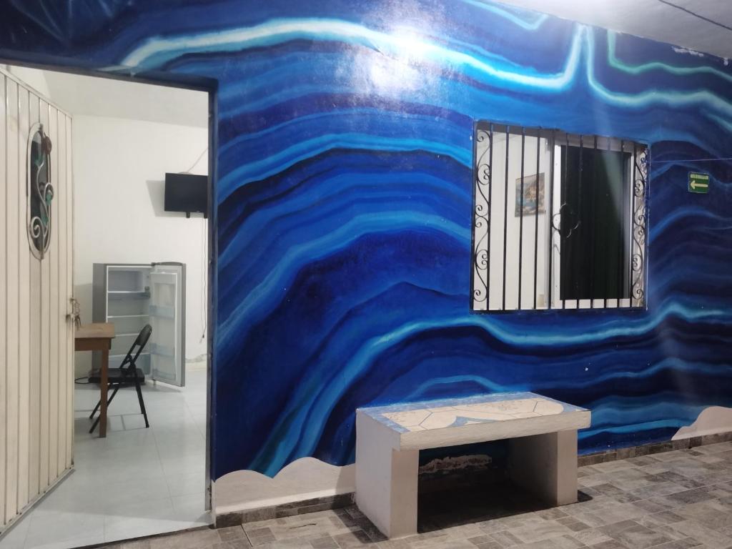 TV a/nebo společenská místnost v ubytování Blue Hotel