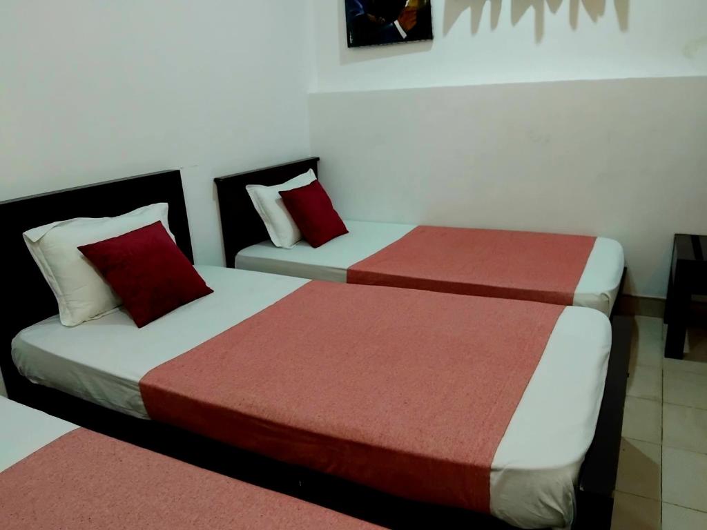 Postel nebo postele na pokoji v ubytování Paradise Residence Hanthana