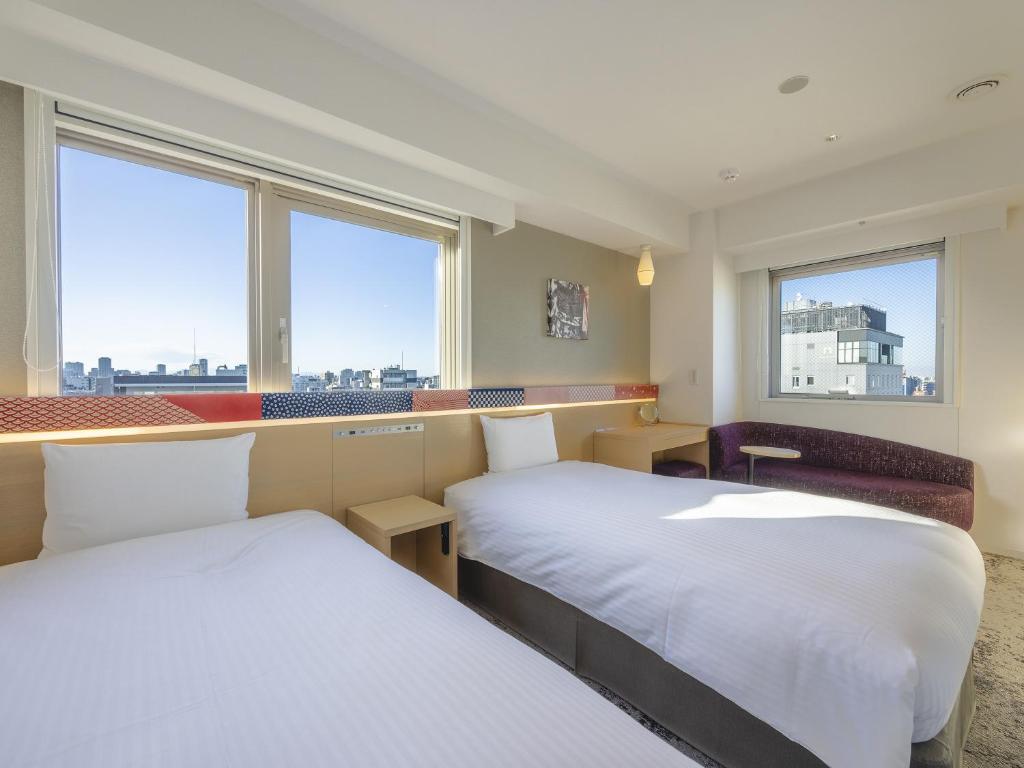 Postel nebo postele na pokoji v ubytování Hotel Gracery Asakusa