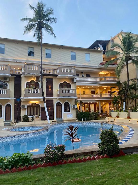 Bazén v ubytování Sukhmantra Resort & Spa - Candolim Goa nebo v jeho okolí