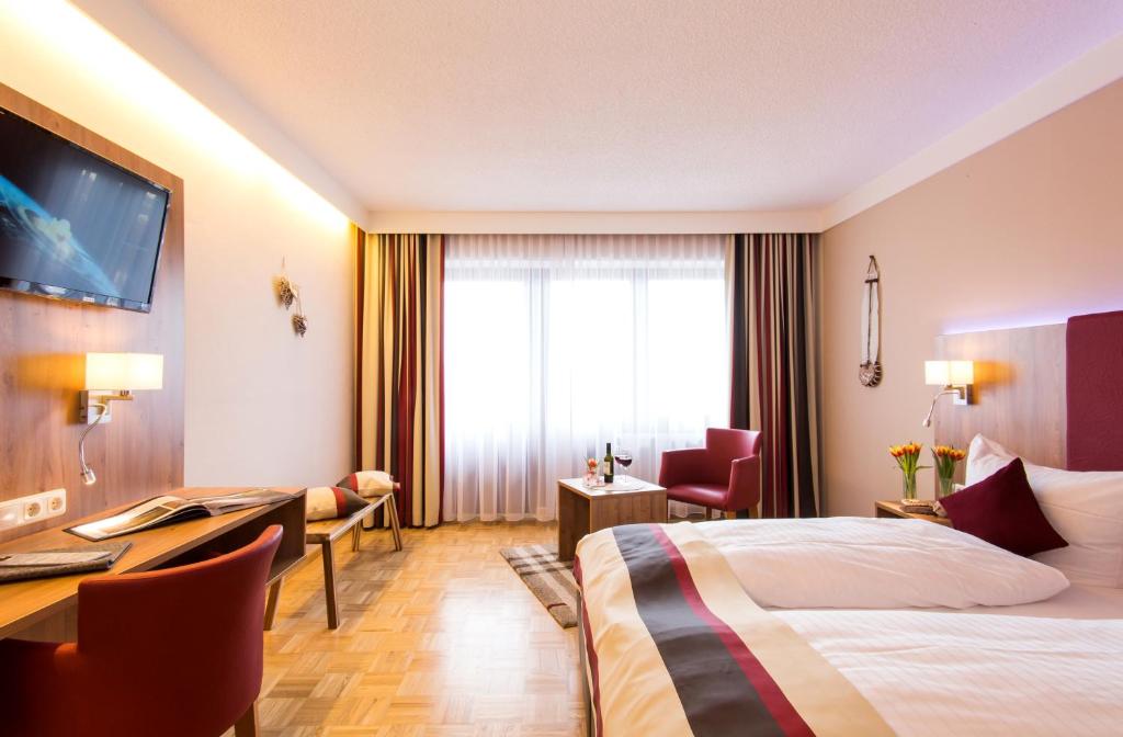Postel nebo postele na pokoji v ubytování Genusshotel "Zum Wendl"