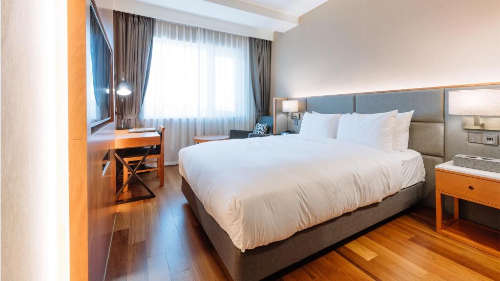 Postel nebo postele na pokoji v ubytování Hotel Interburgo Daegu