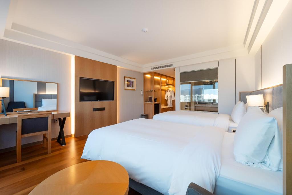 Postel nebo postele na pokoji v ubytování Hotel Interburgo Daegu