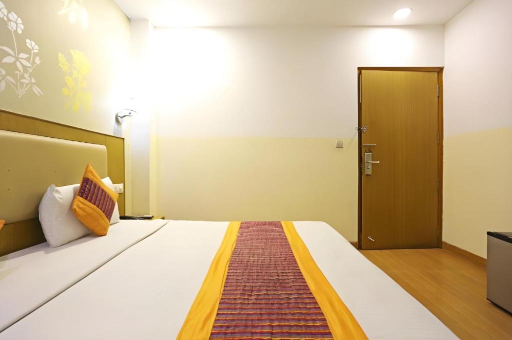 Postel nebo postele na pokoji v ubytování Hotel Oakwood
