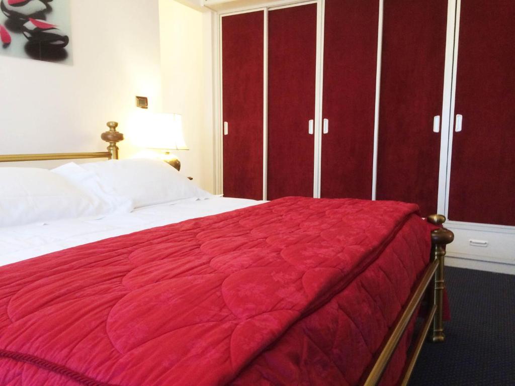 Postel nebo postele na pokoji v ubytování Hotel Michelangelo